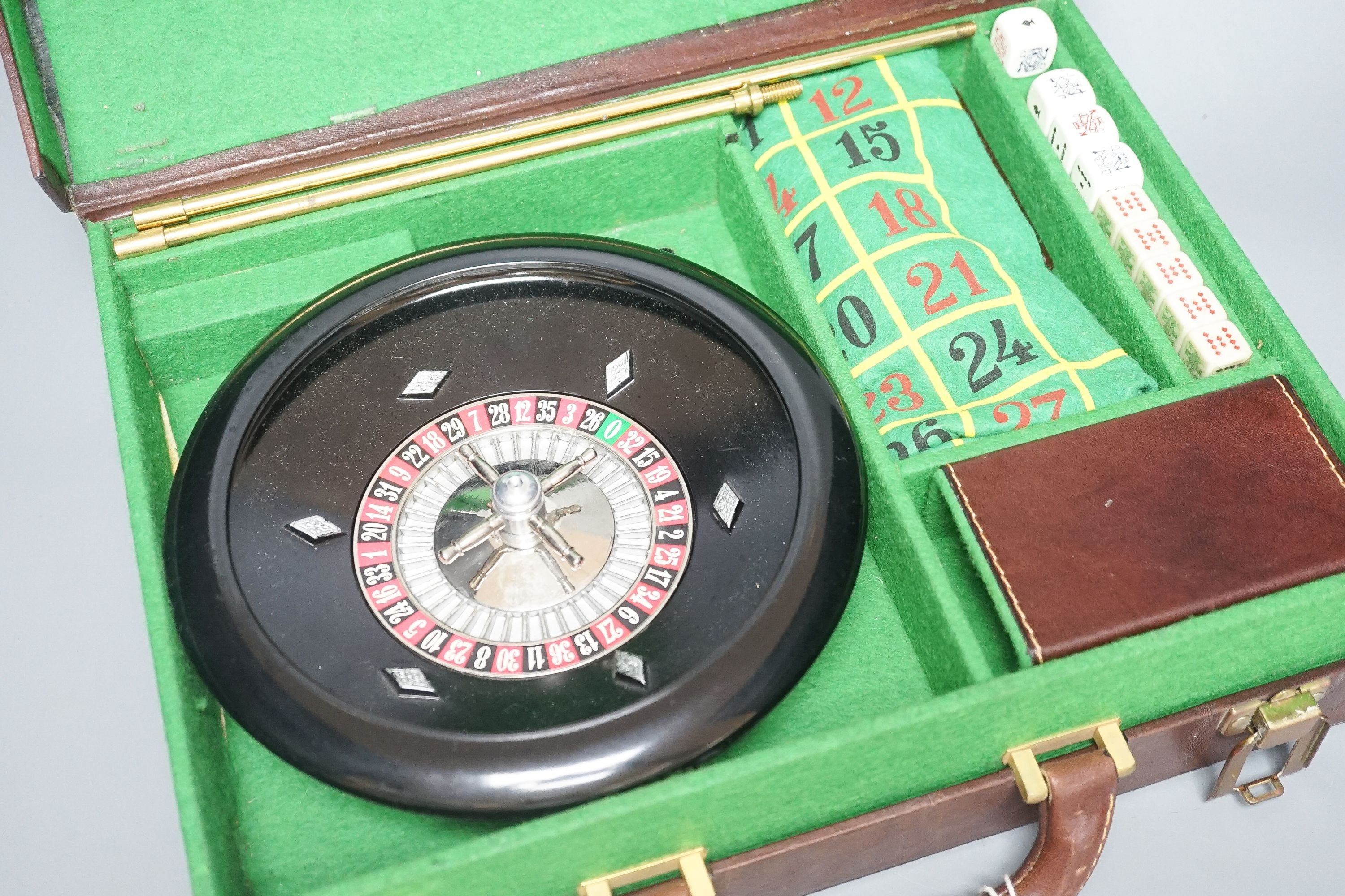 An Asprey tan leather cased games box